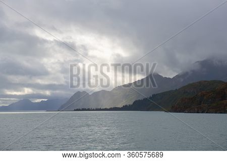 Sunlight Over Glacier Mountain Near Aialik Glacier On Aialik Bay In Kenai Fjords National Park In Se