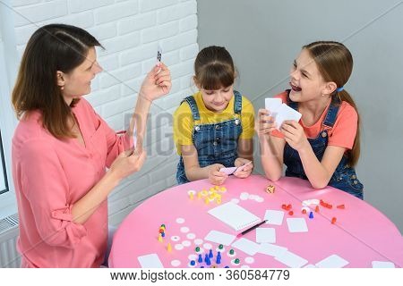 Mom Makes Another Move Playing A Board Game