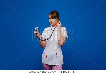 Female Doctor Gesturing Check Up Heart Beat In Doctor Office At Hospital By Using Stethoscope, Isola