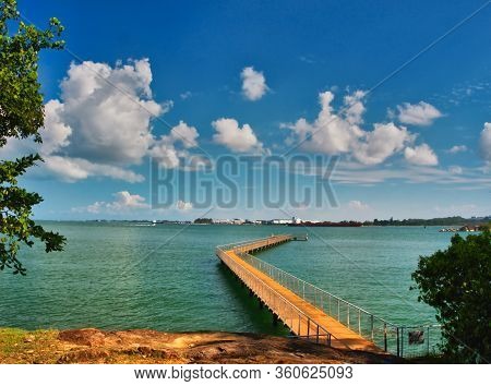 A Boardwalk Over Water Near The Visitor Centre At Chek Jawa Wetland At Pulau Ubin Island, Singapore.