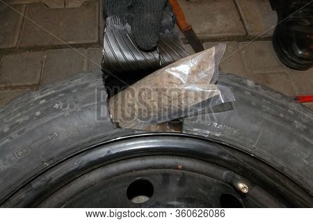 Smilnitsa, Ukraine - November 2016: Smuggled Amber Hidden In The Spare Wheel (reserve Tire) Of A Car