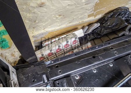 Krakovets, Ukraine - May, 2019: Smuggled Cigarettes Extracted From A Specially Equipped Cache In A V
