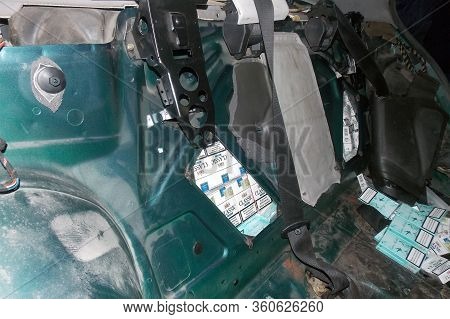 Krakovets, Ukraine - December, 2013: Smuggled Cigarettes Hidden In The Body And Passenger Compartmen