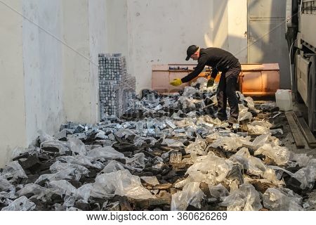 Krakovets, Ukraine - May, 2019: The Border Guard In Special Uniforms Throws Smuggled Cigarettes, Whi