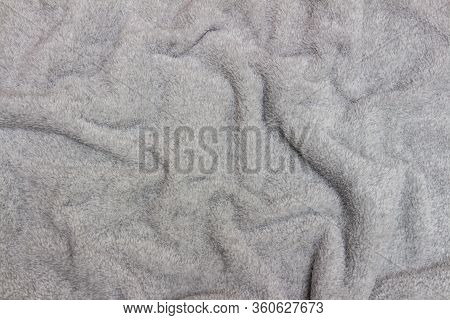 Gray Crumpled Bedspread Texture For Background. Close-up Of Natural Warm Wool Coverlet, Wrap, Coverl