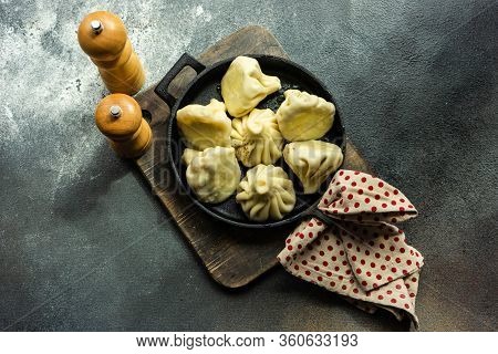 Traditional Georgian Khinkali Dish On Stone Background