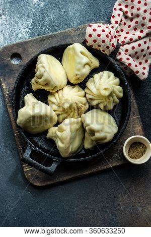 Traditional Georgian Khinkali Dish On Stone Background