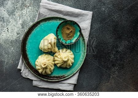 Traditional Georgian Khinkali Dish On Stone Background