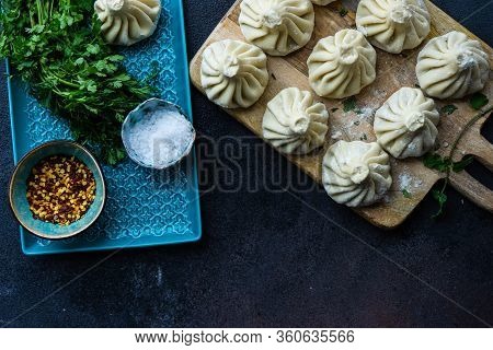 Traditional Georgian Khinkali Dish On Stone Background