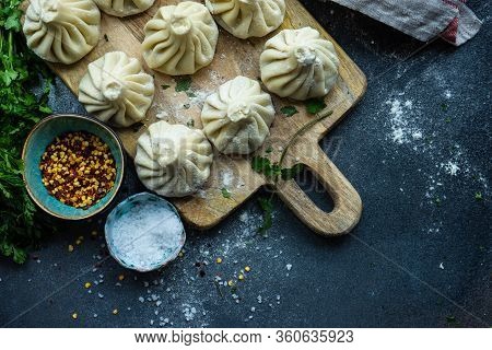 Traditional Georgian Khinkali Dish On Stone Background
