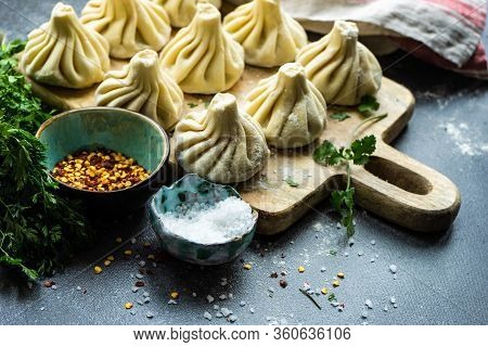 Traditional Georgian Khinkali Dish On Stone Background