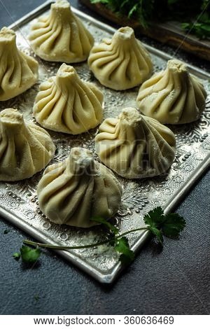 Traditional Georgian Khinkali Dish On Stone Background
