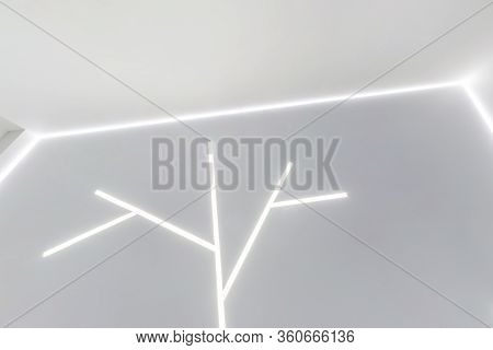 Looking Up On Suspended Ceiling With Halogen Spots Lamps And Drywall Construction In Empty Room In A