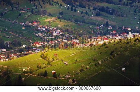 Romanian Mountain Village At Sunset Or Sunrise