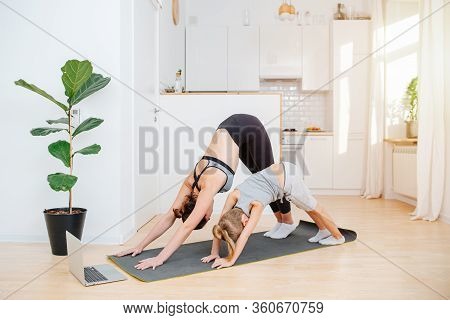 Mom And Son Preschooler Do Morning Yoga At Home