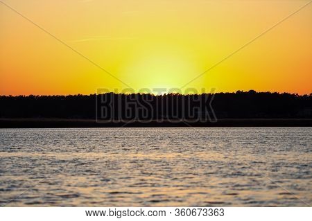 Yellow Sunset View On Late Evening Near River Lielupe. Photo Taken In Latvia.