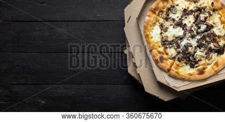 Pizza Funghi In An Open Delivery Box, Dark Backdrop With Text Space. Delivery Foods, Takeaway Food C