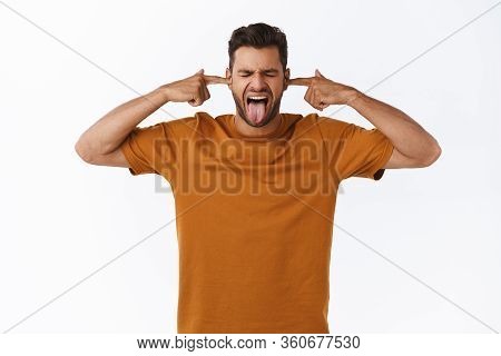 Childish Young Millennial Bearded Guy Acting Immature, Hate Being Adult, Cover Ears With Index Finge