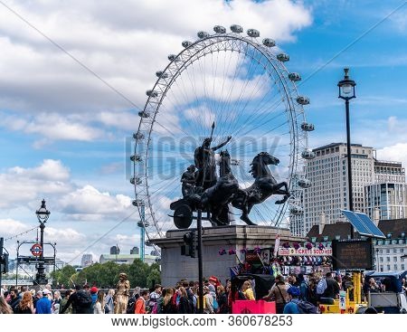 London, England, Uk - September 8, 2019: Famous Boadicea Heroic Statue And The Eye Of London Accross