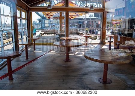 Tables Inside The Granville Island Public Marketplace Taped Off And Off Limit During The Covid-19 Pa