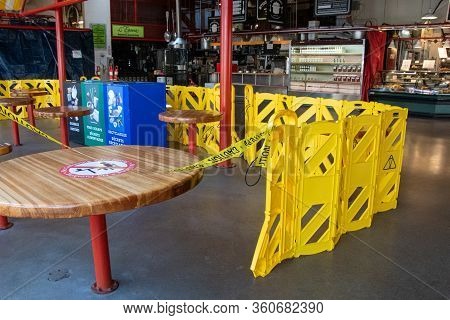 Tables Inside The Granville Island Public Marketplace Taped Off And Off Limit During The Covid-19 Pa