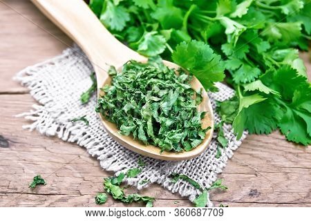 Cilantro Dried In Spoon On Old Board