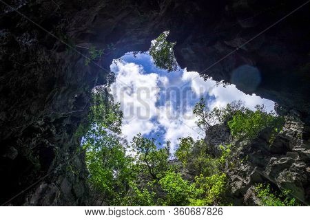 Caves In Limestone Cliffs, Phang Nga Bay, Thailand