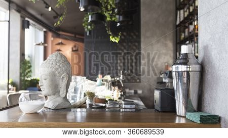 Stylish Cafe Interior, Bar Counter With Figurine Head, Panorama, Copy Space, No People