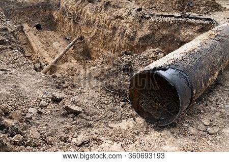 repair and replacement main pipeline of heating systems, district heating pipes network, water supply or Sewerage in city, removing old pipes and replacing them with new ones in a hole in the ground