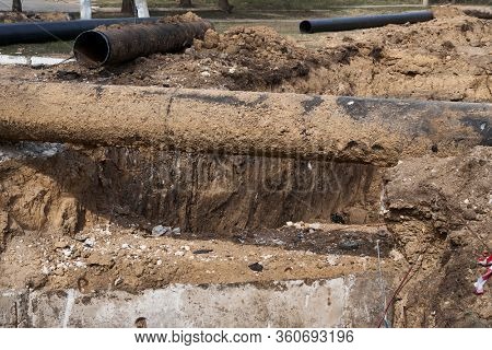 repair and replacement main pipeline of heating systems, district heating pipes network, water supply or Sewerage in city, removing old pipes and replacing them with new ones in a hole in the ground