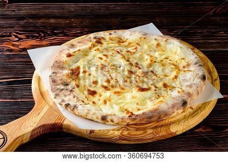 Classic Round Cheese Pie With Brownish Crust Or Italian Quatro Formaggi Pizza Or Georgian Khachapuri