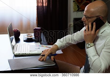 Man Teleworking At Home. Confinement Due To Coronavirus