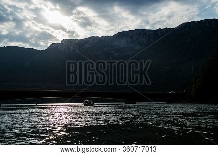 Boat Walks On Danube River, Landscape With Danube River And Mountains, Cazanele Dunarii, Romania.