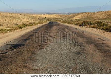 A363 Highway, Asphalt Road Along The Southern Shore Of Lake Issyk-kul In Kyrgyzstan.