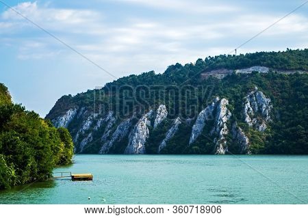 Pontoon On Danube River, Landscape With Water And Mountains, Cazanele Dunarii, Romania.