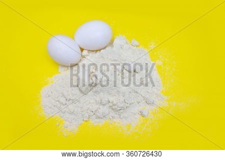 Pile Of Banana Protein Powder And Eggs Isolated On Yellow Background