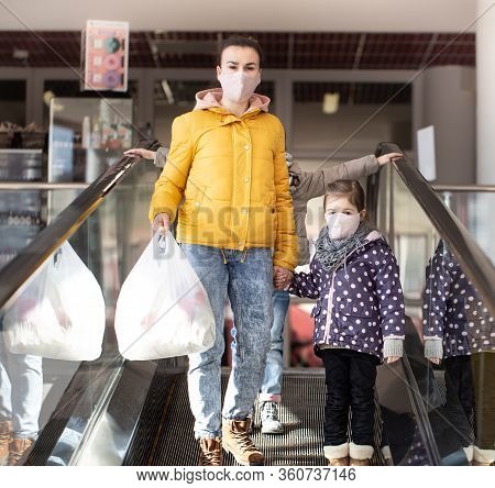 Mom And Kids Are Shopping At The Grocery Store.