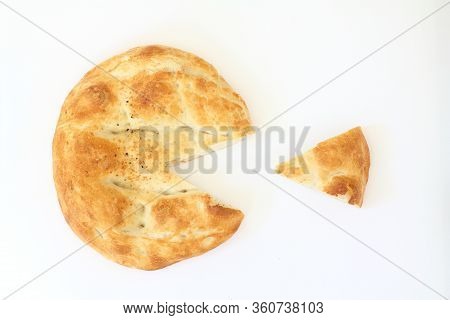 Slices Of Ramadan Pita (ramazan Pidesi) Traditional Turkish Bread For Holy Month Ramadan On White Ba