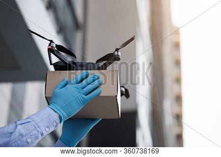 Man Using Drone For Fast Delivery Of Package With Products, Safety Delivery On Quarantine, Copy Spac