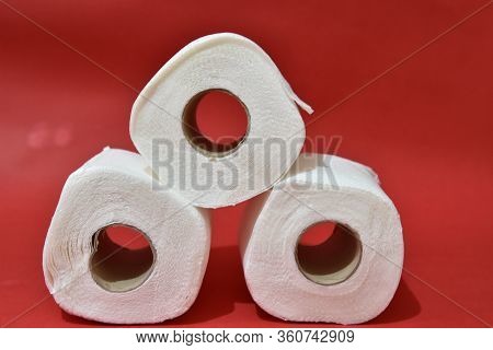 Roll Of Toilet Paper On Red Background