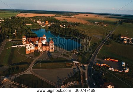 Mir Orange Castle With Spiers Near The Lake A Top View In Belarus In Nesvizh