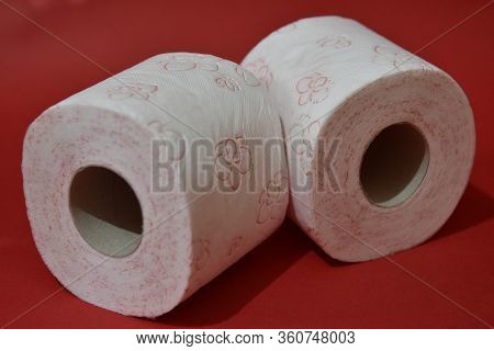 Roll Of Toilet Paper On Red Background