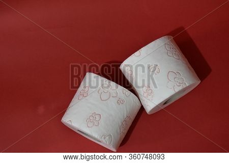 Roll Of Toilet Paper On Red Background