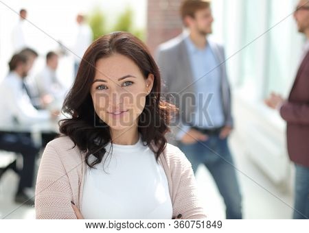 portrait of a young business woman on the background of the offi