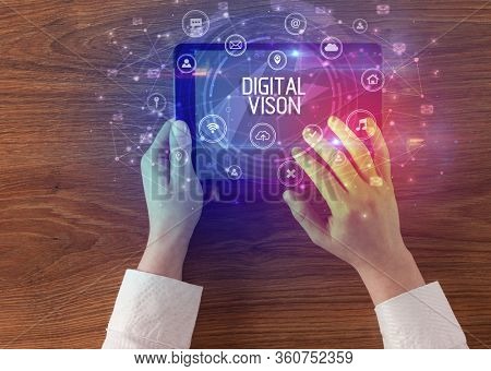 Close-up of a tablet with DIGITAL VISON inscription, innovative technology concept