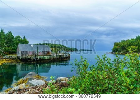 Views Of The Bay, Boats And Waterfront Buildings In The Fishing Village Aspotogan, Nova Scotia, Cana