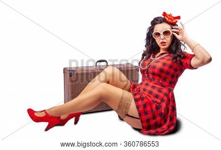 Young Pretty Woman In Sunglesses, Red Dress And Nylon Stockings Sitting On The Floor Near Vintage  S