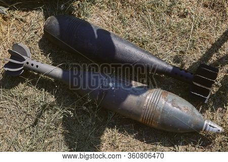 Two Unexploded Aerial Bombs Lie On The Ground