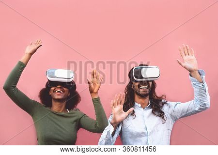 Happy Couple Using Virtual Reality Headset Outdoor - Trendy People Having Fun With Innovated Vr Goog