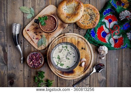Georgian Satsivi And Lobio On A Wooden Table